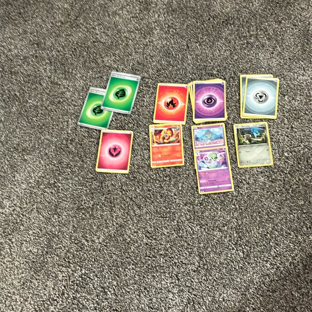 Pokémon bundle, including energy, power ups, and cards
